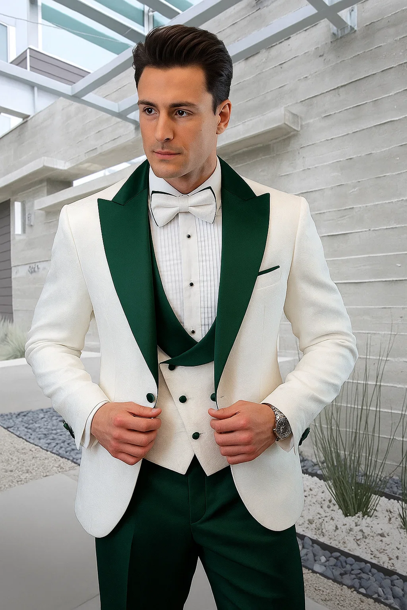Elegant men's tuxedo: white paisley jacket, hunter green shawl collar & satin finish. Matching vest, pleated white dress shirt. Hunter green pants complete the formal ensemble.
