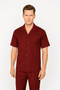Burgundy leisure suit: short-sleeve shirt with a classic collar, front pocket, button closure. Seamless pants. Smooth, structured fabric, matching color.
