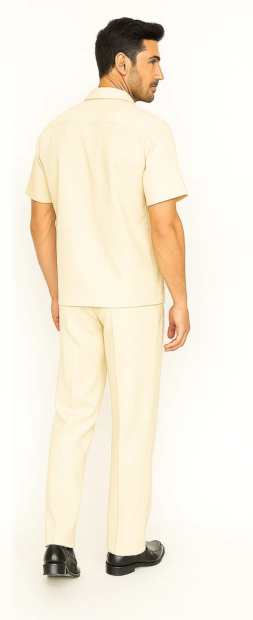 Cream men's leisure suit. Includes short-sleeve shirt and straight-leg pants. Lightweight, smooth fabric. Shirt: simple collar, straight cut. Pants: tailored, side seams. Casual wear.
