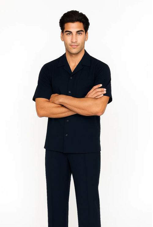 Navy leisure suit: short-sleeved, button-up shirt with collar, and matching trousers. Smooth, lightweight fabric. Ideal for relaxed wear.
