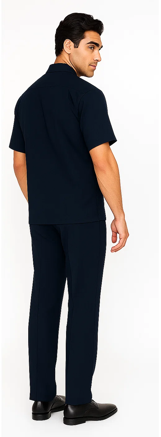Men's navy walking suit: short-sleeve shirt & pants. Smooth, woven material. Shirt: straight collar, relaxed fit. Pants: tapered leg. Solid navy, no patterns. Cohesive, comfortable design.
