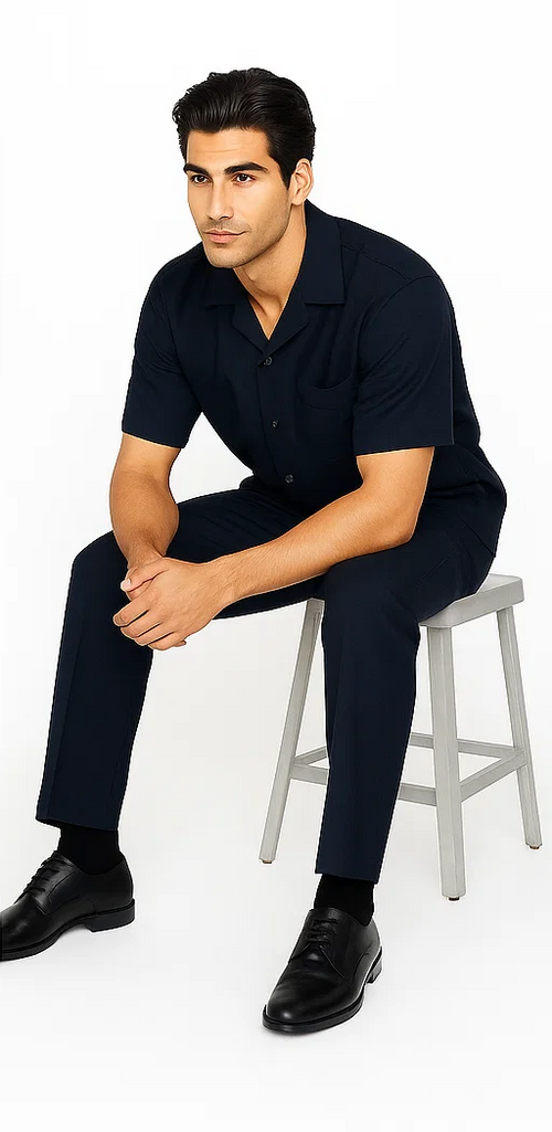 Navy leisure suit: short-sleeve collared shirt & straight-leg pants. Smooth fabric for a coordinated, relaxed look.
