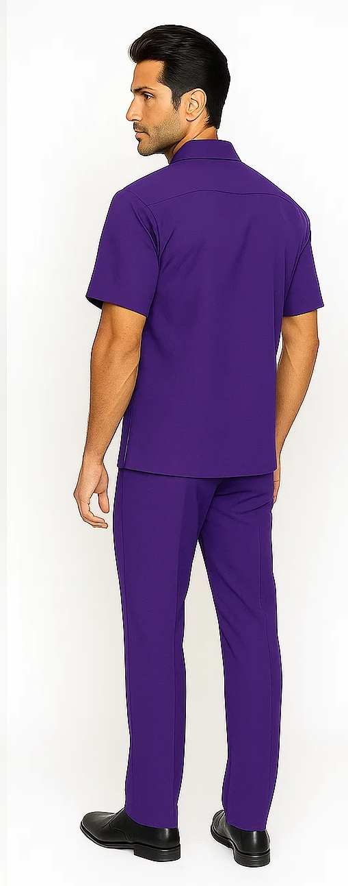 Men's solid purple leisure suit. Short-sleeved, relaxed-fit shirt & matching pants. Smooth, lightweight fabric. Casual, uniform design. Standard collar for a coordinated look.
