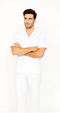 White men's leisure suit: short-sleeve shirt with collar and button closure, plus matching straight-leg pants. Solid white color. Simple and classic.
