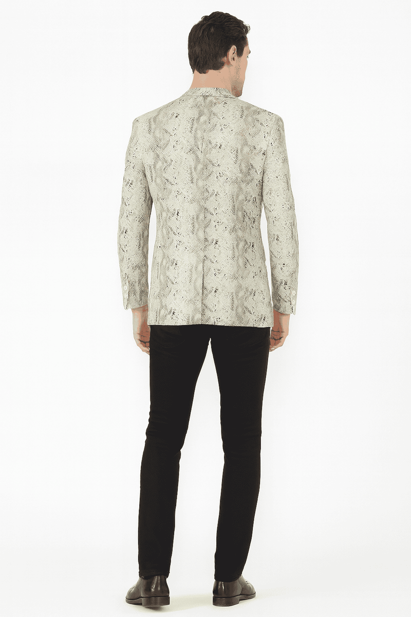 Men's slim-fit white snake print blazer. Structured shape with textured muted white & gray snakeskin pattern. Decorative sleeve buttons. Contoured figure fit.

