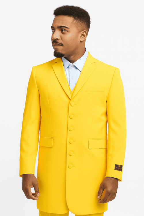 Men's yellow zoot suit. Single-breasted jacket with notched collar, 5 buttons, and pockets. Matching tailored trousers. Smooth, structured fabric. 1920s-inspired elongated silhouette. Bright yellow color.