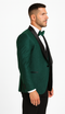 Men's hunter green designer tuxedo with textured fabric, black satin shawl lapel, and single-button closure. Includes white dress shirt and black bow tie.
