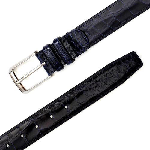 Dark blue Mezlan AO7907 alligator belt. Glossy finish, distinctive alligator pattern, and metal buckle. Tapered end with multiple adjustment holes for a customizable fit.
