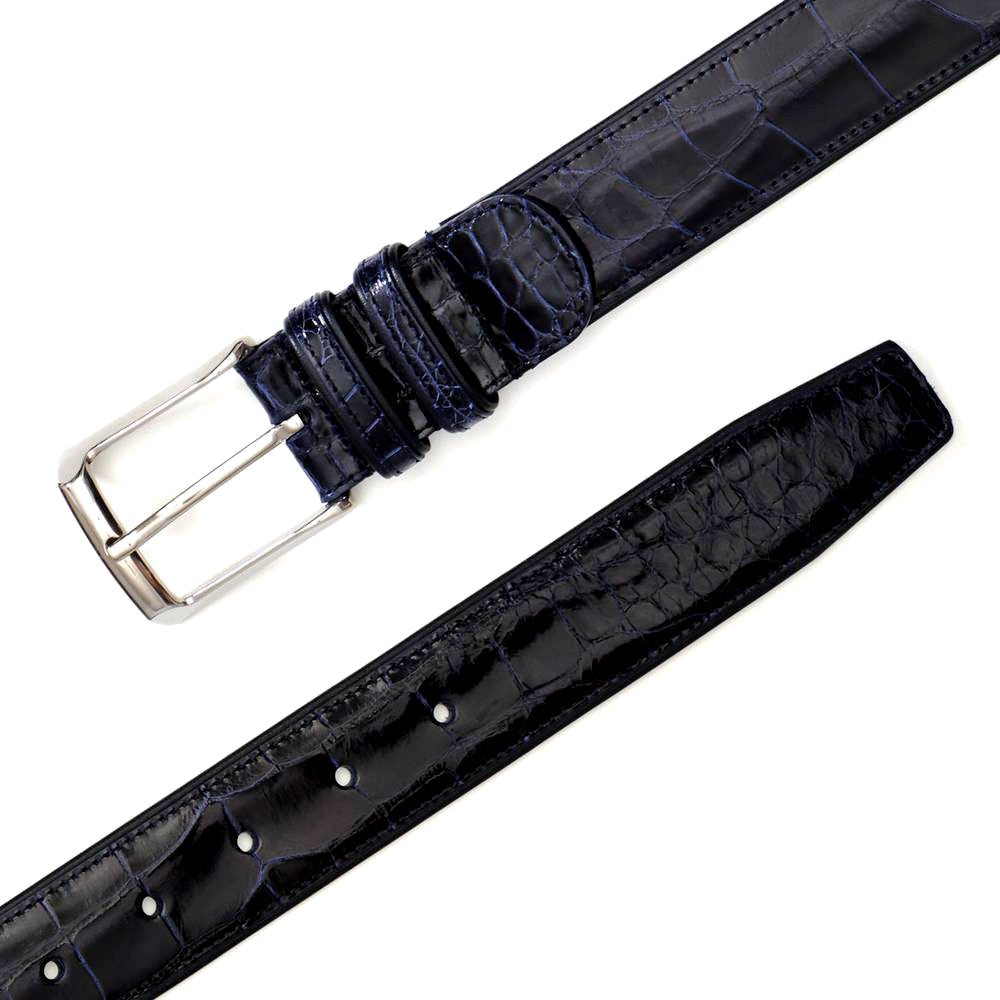 Dark blue Mezlan AO7907 alligator belt. Glossy finish, distinctive alligator pattern, and metal buckle. Tapered end with multiple adjustment holes for a customizable fit.