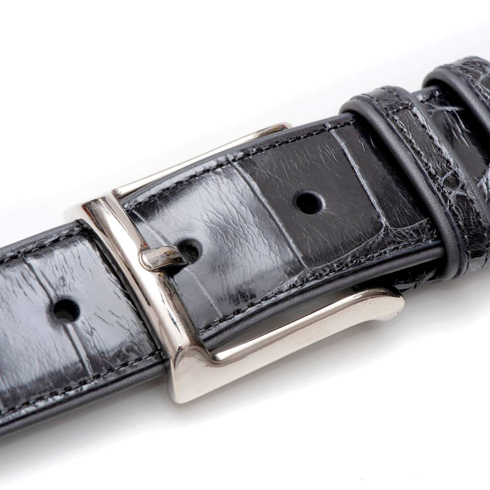 Mezlan AO7907 alligator belt in gray. Genuine leather with alligator texture. Silver buckle. Adjustable fit with multiple holes. Elegant and stylish.
