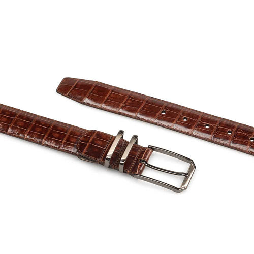 Mezlan crocodile belt: narrow, elongated shape with textured surface and crocodile pattern. Rich brown color, featuring a metal buckle.
