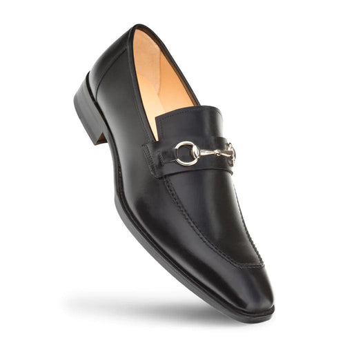 Black Mezlan leather loafers with a pointed toe and low heel. Silver ornament on the vamp. Minimal stitching and leather lining.
