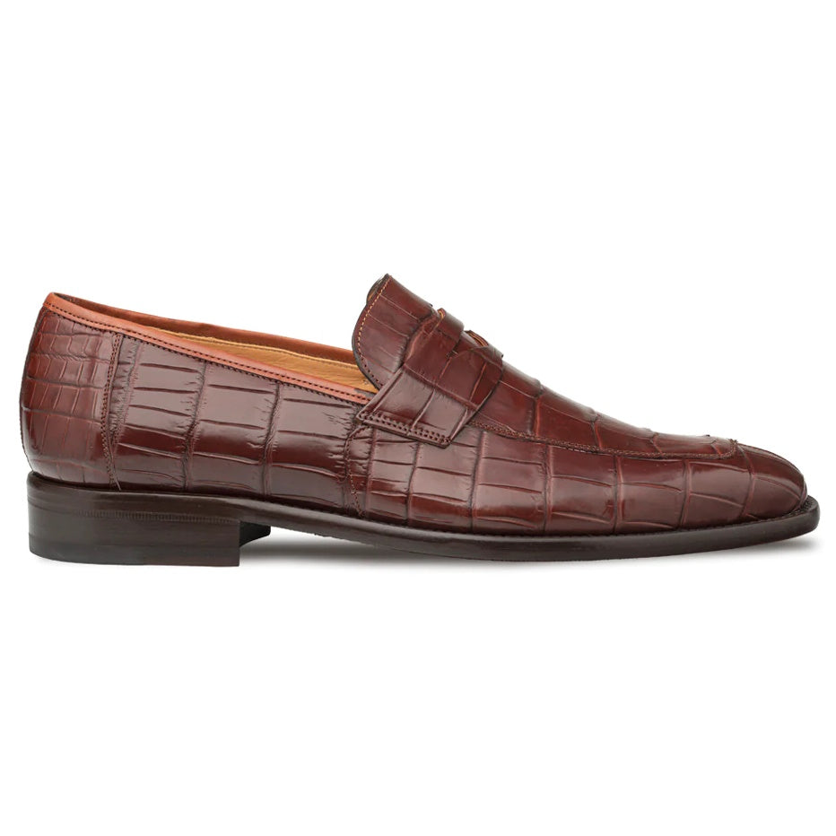 Mezlan Piccolo penny loafer in dark reddish-brown alligator leather. Elongated silhouette, penny slot, and textured reptilian scale pattern. Flat sole, modest heel, leather lining.
