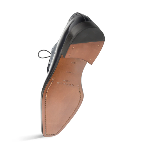 Mezlan Potsdam shoe: Blue deerskin calfskin with round toe & lace-up design. Brown leather sole with black heel, metal studs & detailed stitching. Classic style.
