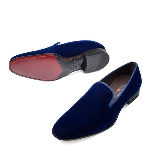 Mezlan Lublin navy velvet tuxedo loafers: sleek, formal slip-ons. Navy velvet exterior, smooth texture, elongated silhouette. Classic slip-on design with rounded toe. Black sole with red heel detail. Polished for formal wear.
