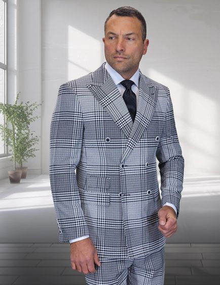 The Statement mens 2 piece double-breasted suit features a modern fit with a plaid pattern. It is made of 100% wool, predominantly in shades of gray and white, with black accents. The suit comprises a structured jacket with a double-breasted front, complete with two rows of buttons, and matching trousers.