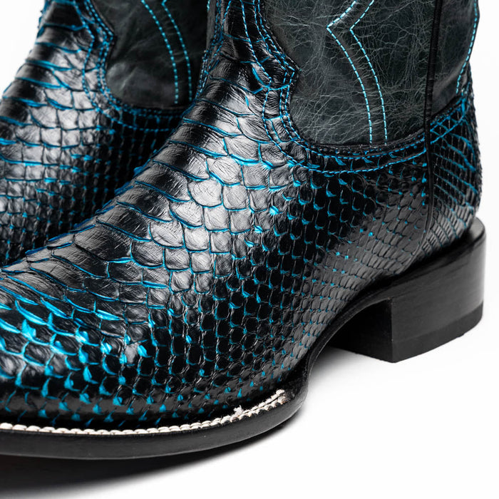 Marco Di Milano Missouri cowboy boots in black python leather. Square toe, blue stitching, and flat heel. Textured upper with a smooth sole edge finish.
