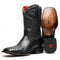 Marco Di Milano Missouri cowboy boots in black python. Pointed square toe, textured leather. Intricate stitched shaft, red lining, and leather sole with brand name. Slightly raised heel.
