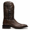 Brown python cowboy boots by Marco Di Milano. Tall shaft, square toe, and detailed stitching. Made with textured brown python skin. Raised heel and contrasting materials add structure and visual appeal.
