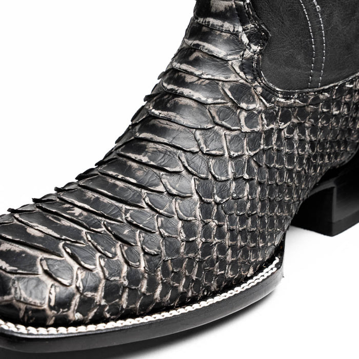 Marco Di Milano Missouri Stone cowboy boots. White python skin texture with black and white scales. Square toe design with subtle stitch detail. Black sole.
