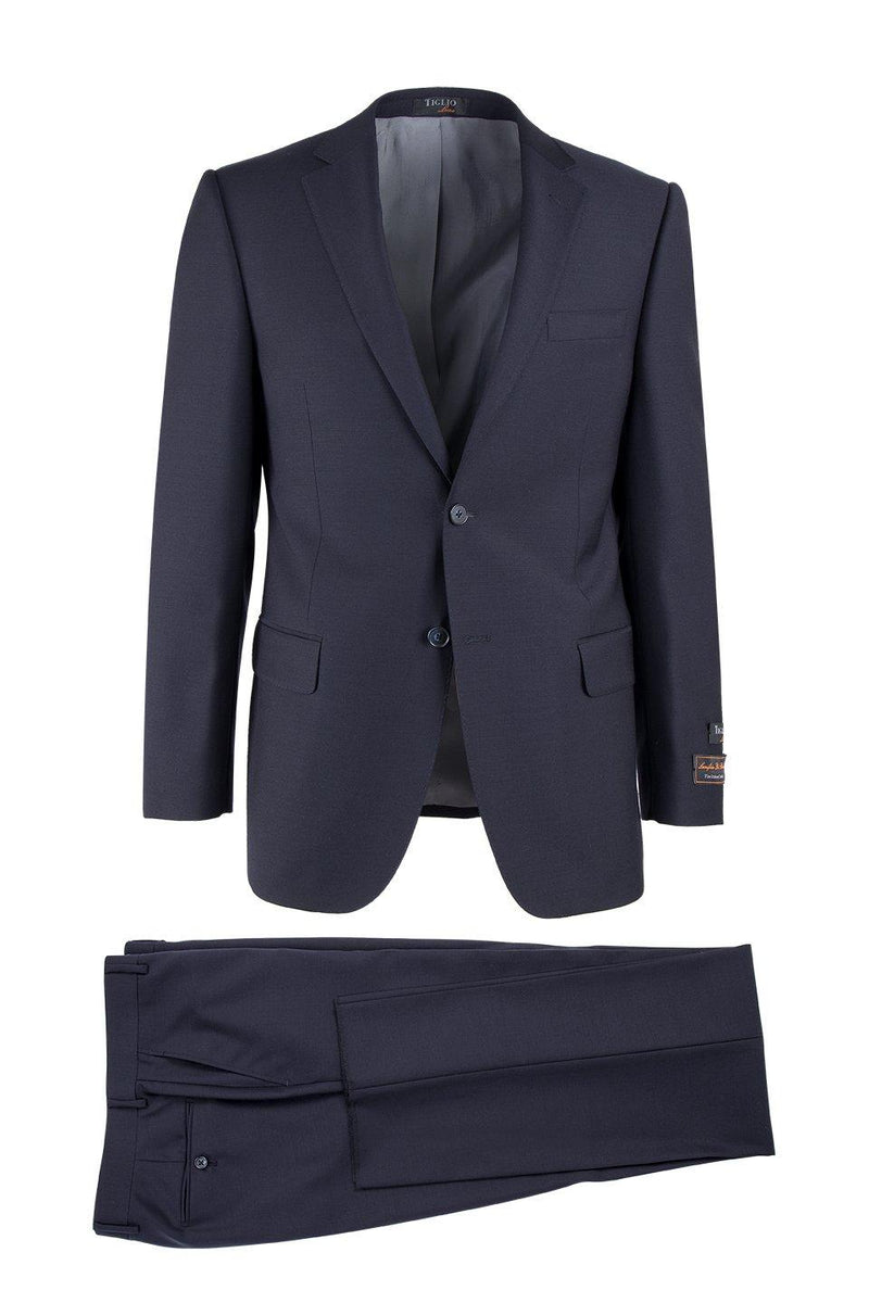 Tiglio Italian navy suit: two-piece, tailored blazer and trousers. Blazer: single-breasted, notched lapels, fitted. Trousers: straight-leg, flat front. Likely a smooth wool blend fabric.
