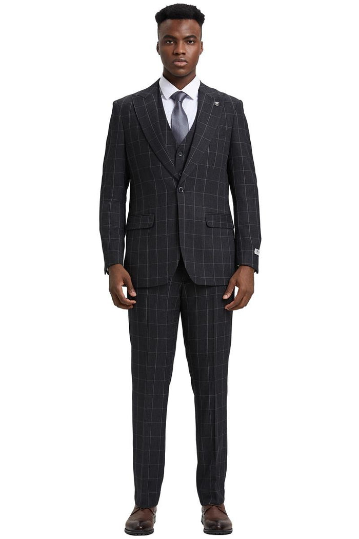 The Stacy Adams vest is dark charcoal grey with a classic bold windowpane pattern in lighter lines. It features a tailored fit and has a smooth texture.