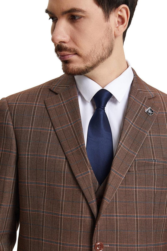 Stacy Adams men's modern fit suit in light brown with windowpane plaid. Includes vest, notched lapel, single-button closure. Navy tie complements the look.
