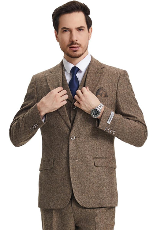 Light brown Stacy Adams vintage tweed suit. Herringbone pattern, structured blazer with notched lapel, button closures, and front pockets. Matching vest. Tailored, classic fit.
