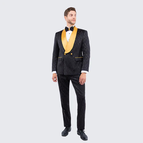 Men's slim-fit black jacquard tuxedo suit with gold shawl lapel. Features patterned fabric, double-button closure, and matching trousers.
