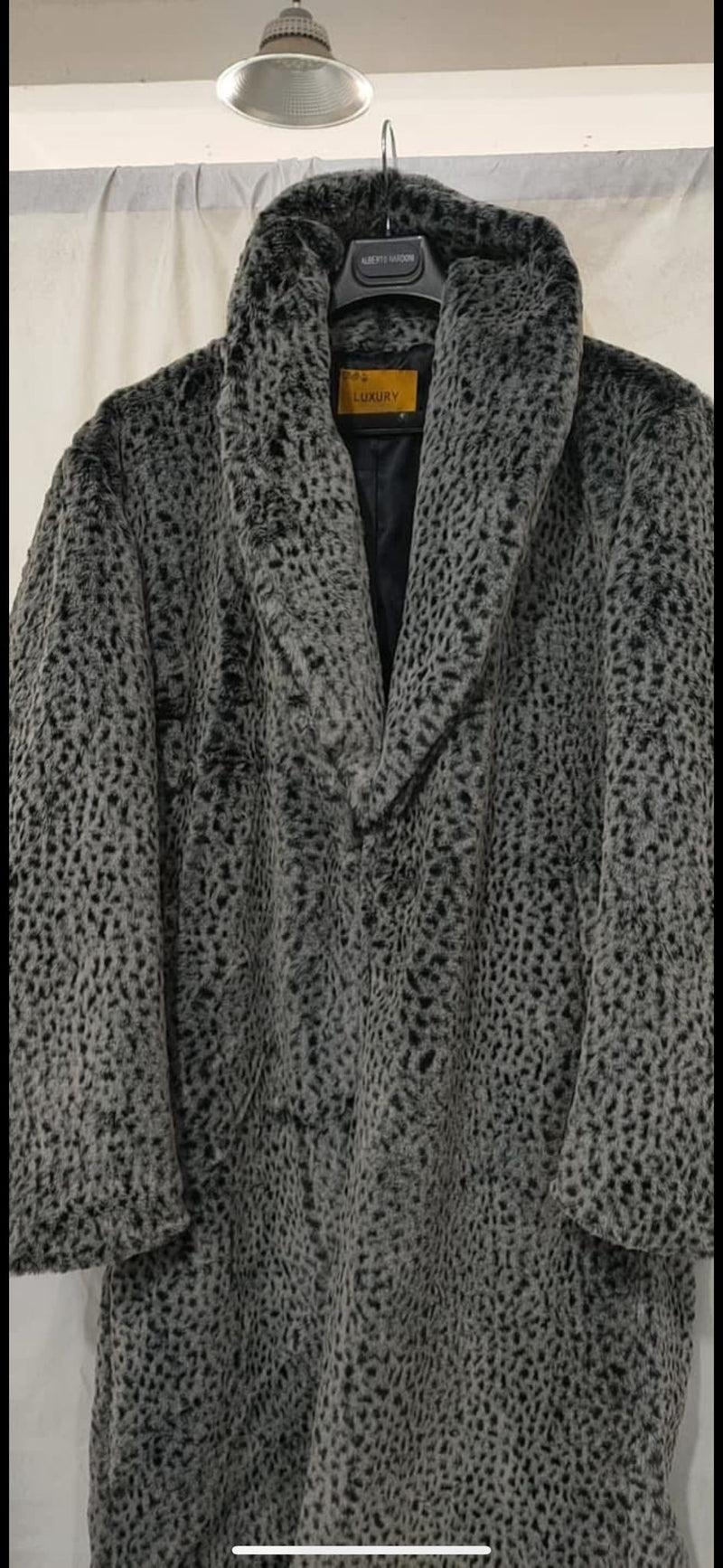 Men's luxury long grey faux fur coat with animal print. Soft, textured surface, wide lapel, and open front. Smooth inner lining.

