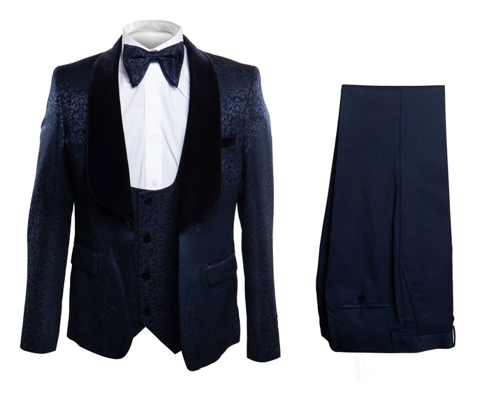 Navy jacquard tuxedo for men. Textured navy jacket with black velvet shawl lapel. Includes matching navy trousers, offering a complete and stylish formal look.
