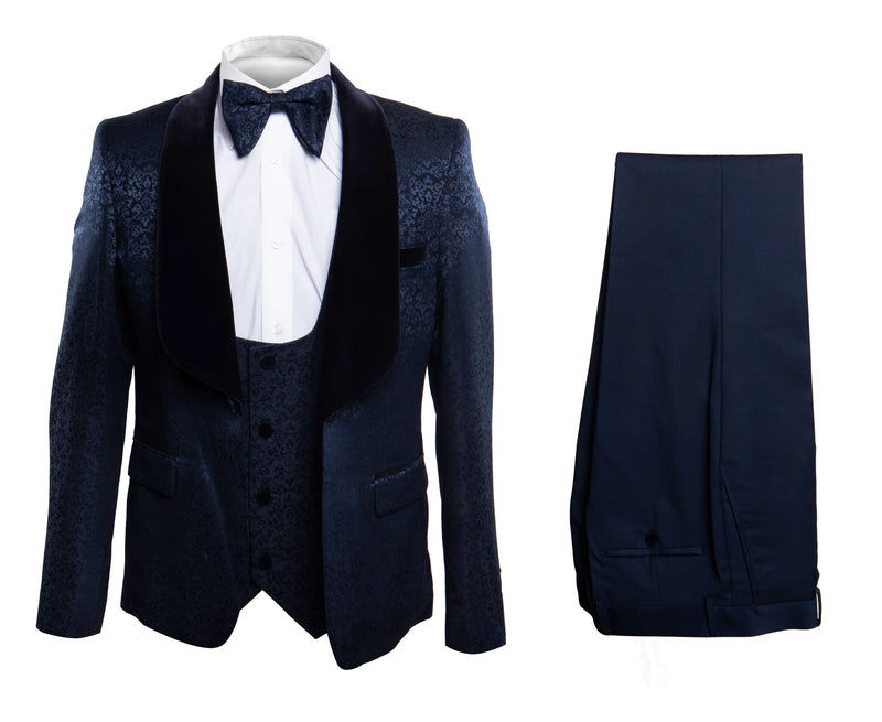 Navy jacquard tuxedo for men. Textured navy jacket with black velvet shawl lapel. Includes matching navy trousers, offering a complete and stylish formal look.
