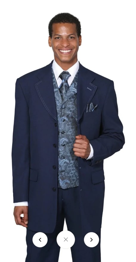 Men's 1920s-style navy zoot suit: long jacket (classic fit), pleated pants, patterned vest. Structured silhouette, notched lapel, five-button jacket. Smooth, slightly sheened fabric.
