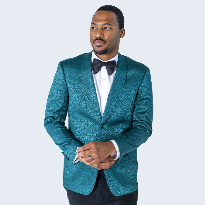 Men's teal blue paisley tuxedo jacket. Elegant shawl lapel, glossy fabric with intricate paisley patterns. Perfect for formal occasions.
