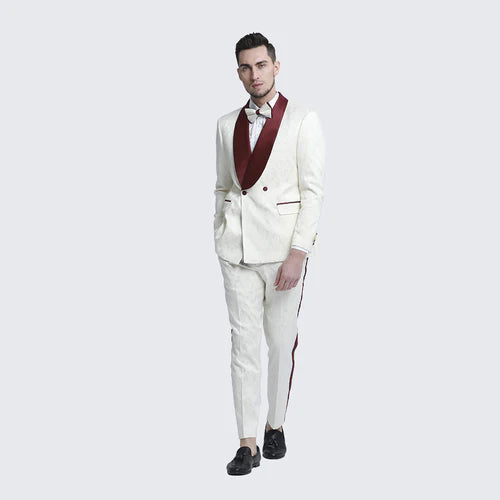 Ivory and burgundy jacquard tuxedo suit. Single-breasted blazer: burgundy shawl lapels, front pockets. Slim-fit trousers: burgundy stripes. Stylish formal wear for men.
