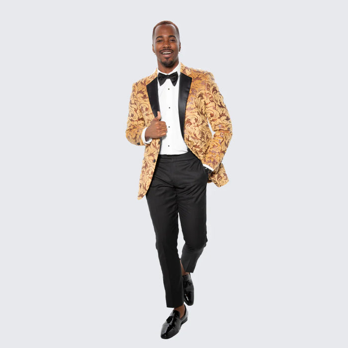 Men's yellow gold baroque tuxedo blazer. Tailored fit, swirling gold design, black satin shawl collar. Paired with black dress pants. Formal and stylish.
