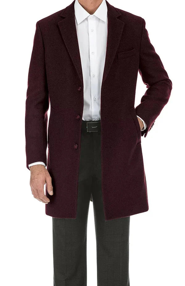 Men's burgundy long coat in wool blend. Classic fit, single-breasted with two buttons & notch lapel. Features chest pocket, cuff detail, & slightly tailored straight cut.
