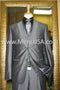 Alberto Nardoni charcoal gray suit. Sleek design, subtle sheen. Notched lapel, single-button closure, tailored fit. Matching vest, textured gray tie. Smooth fabric, contrasting white pocket stitching.
