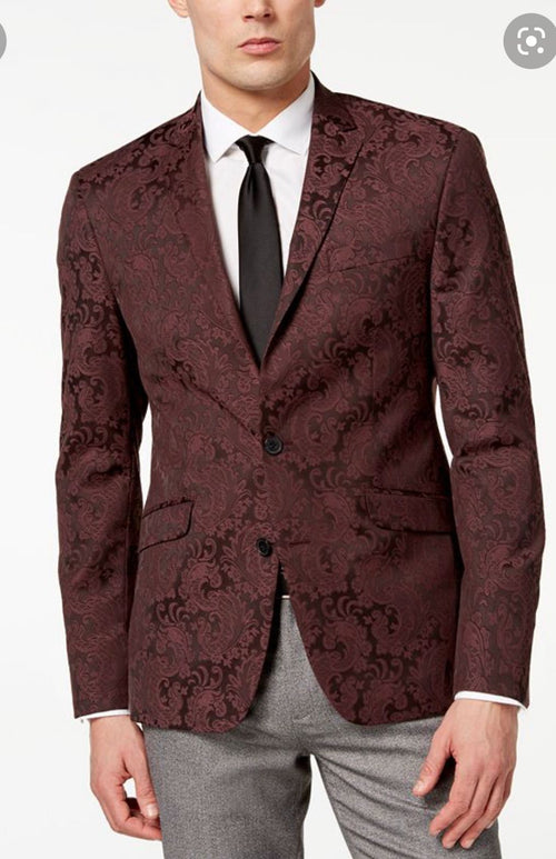 Men's burgundy & black paisley tuxedo blazer. Fitted, single-button closure. Textured paisley pattern. Features notched lapels, 2 pockets, & smooth fabric. Formal style.