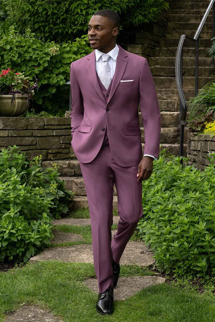 Men's mauve three-piece suit: slim-fit blazer (single button, notch lapels), vest (V-neck), and trousers. Uniform mauve color, smooth fabric, and formal design.
