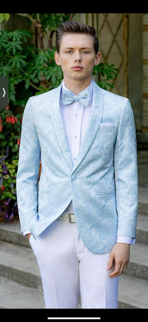Men's light blue paisley tuxedo jacket with matching bow tie. Structured, single-button closure, two pockets. Light blue paisley pattern. Worn over light shirt with visible cuffs.
