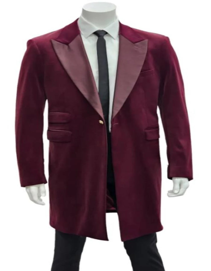 Men's burgundy tuxedo. Velvet long blazer with satin shawl collar, single-button closure, and two side pockets. Sleek, fitted silhouette.
