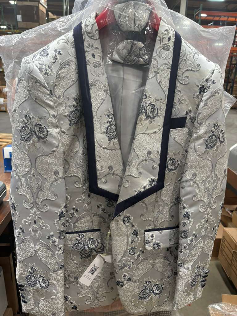Men's white & navy floral jacquard blazer. Contrast shawl lapel, ornate patterns. Double welt pockets, matching pocket square. Stylish & sophisticated.
