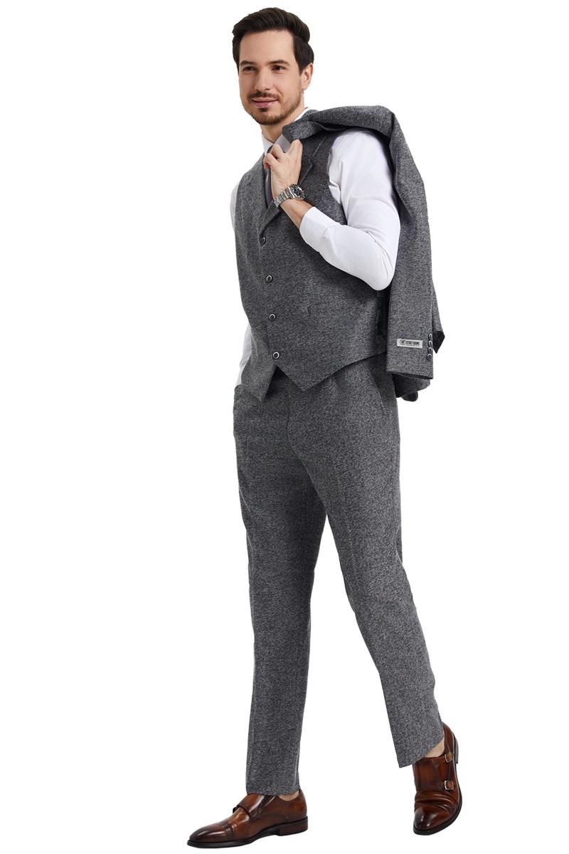 Men's Stacy Adams vintage grey herringbone tweed suit. Includes fitted vest and trousers with a textured, subtle herringbone pattern. Features a grey colorway; vest layered over a white shirt.
