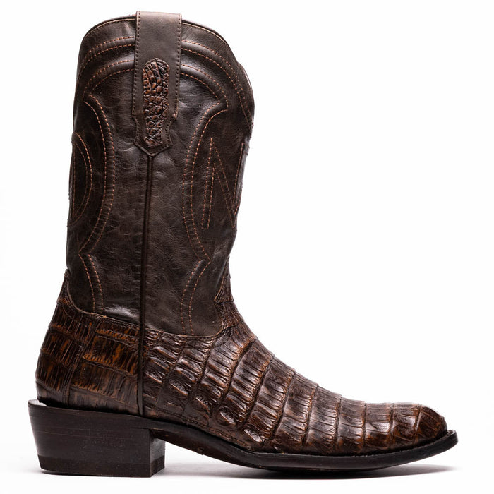 Marco Di Milano Phoenix cowboy boots, aged brown caiman crocodile. Tall shaft, decorative stitching, and scale pattern. Flat sole with a slight heel. Elongated shape, round toe.
