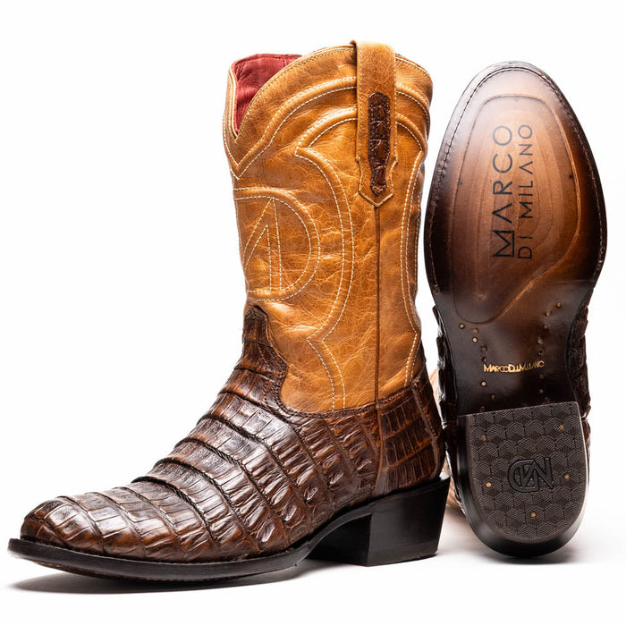 Marco Di Milano Phoenix cowboy boots. Aged maple caiman crocodile and tan leather upper. Round toe, decorative stitching, mid-calf height. Black rubber sole with logo.
