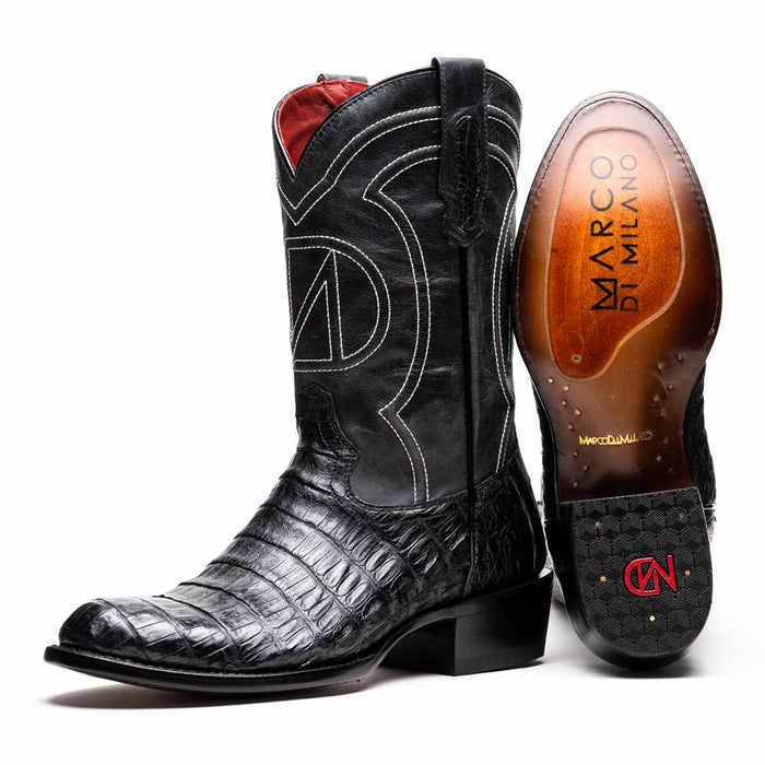 Marco Di Milano Phoenix cowboy boots in glossy black caiman crocodile. Round toe, tall shaft, and intricate stitching. Red lined interior. Stacked heel. Branded sole.
