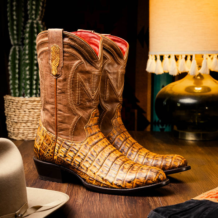 Mustard brown caiman crocodile cowboy boots by Marco Di Milano. Round toe, brown leather shaft, yellow "N" stitch detail, low squared heel, and red leather lining.
