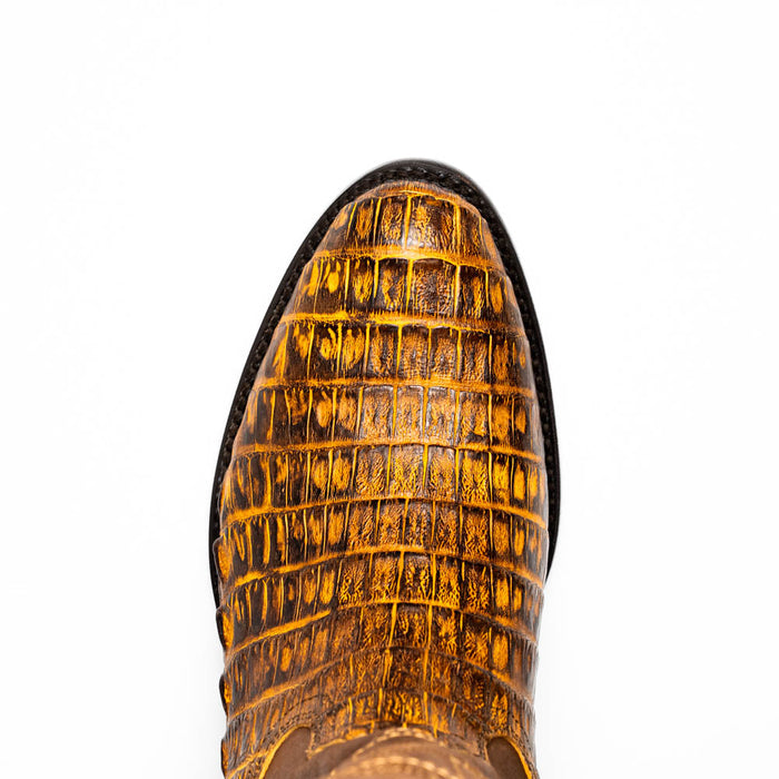 Mustard brown Marco Di Milano Phoenix cowboy boots. Round toe, made from textured caiman crocodile leather. Features a scale-like pattern and yellow/brown color.
