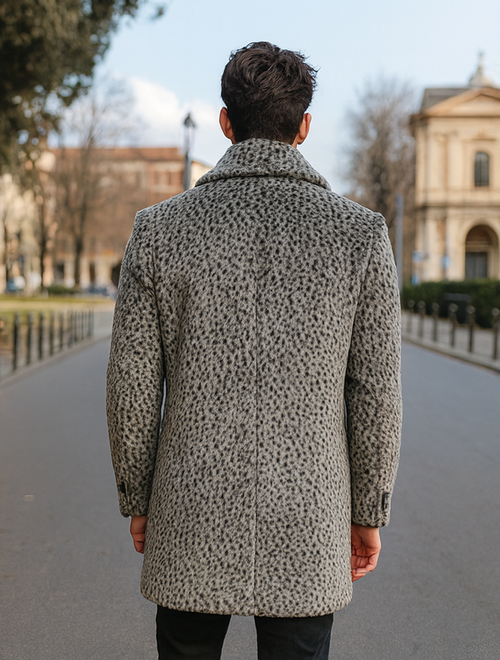 Men's vintage gray faux fur coat with black leopard spots. Long, tailored shape, wide collar, and rear vent. Buttoned cuffs, structured fit, soft texture.
